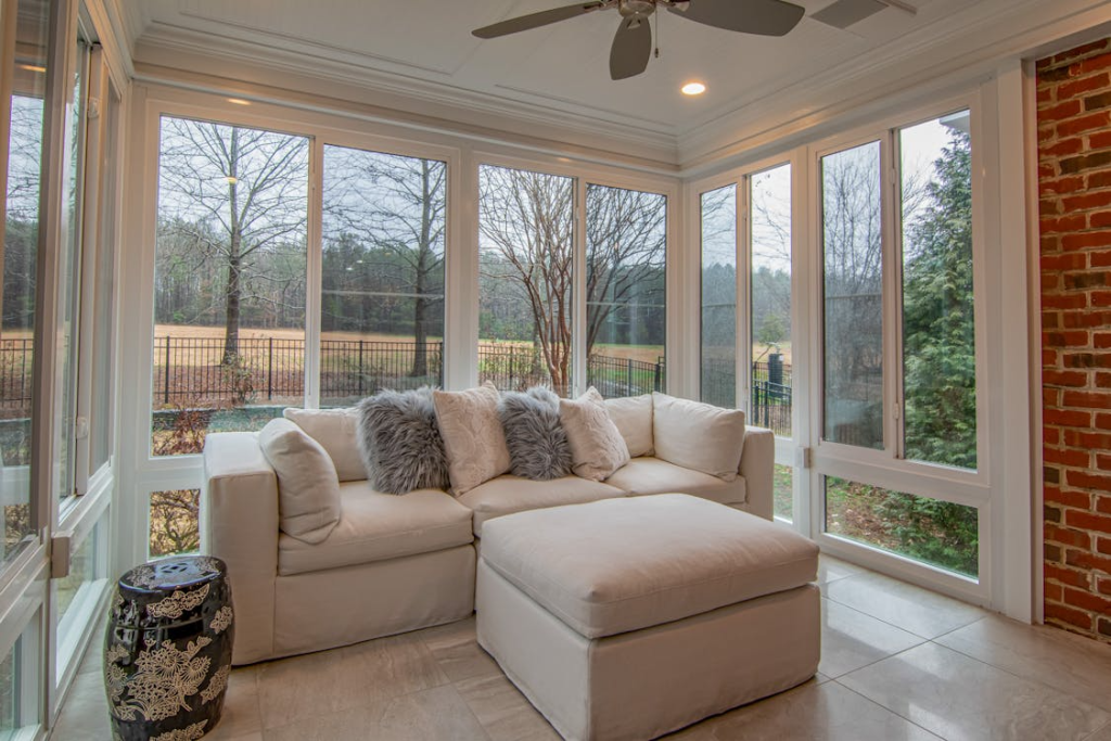  bright screened in porch with natural daylight and relaxing seating area