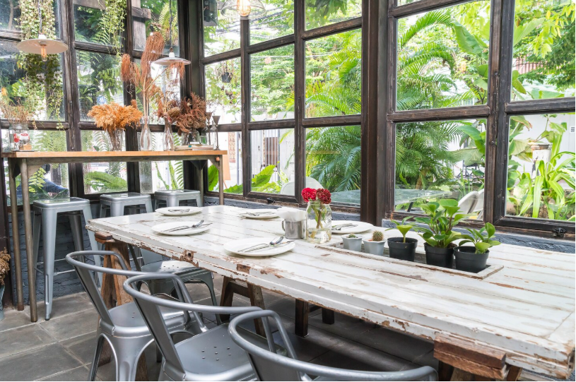 potted plants and greenery incorporated into a screened porch design